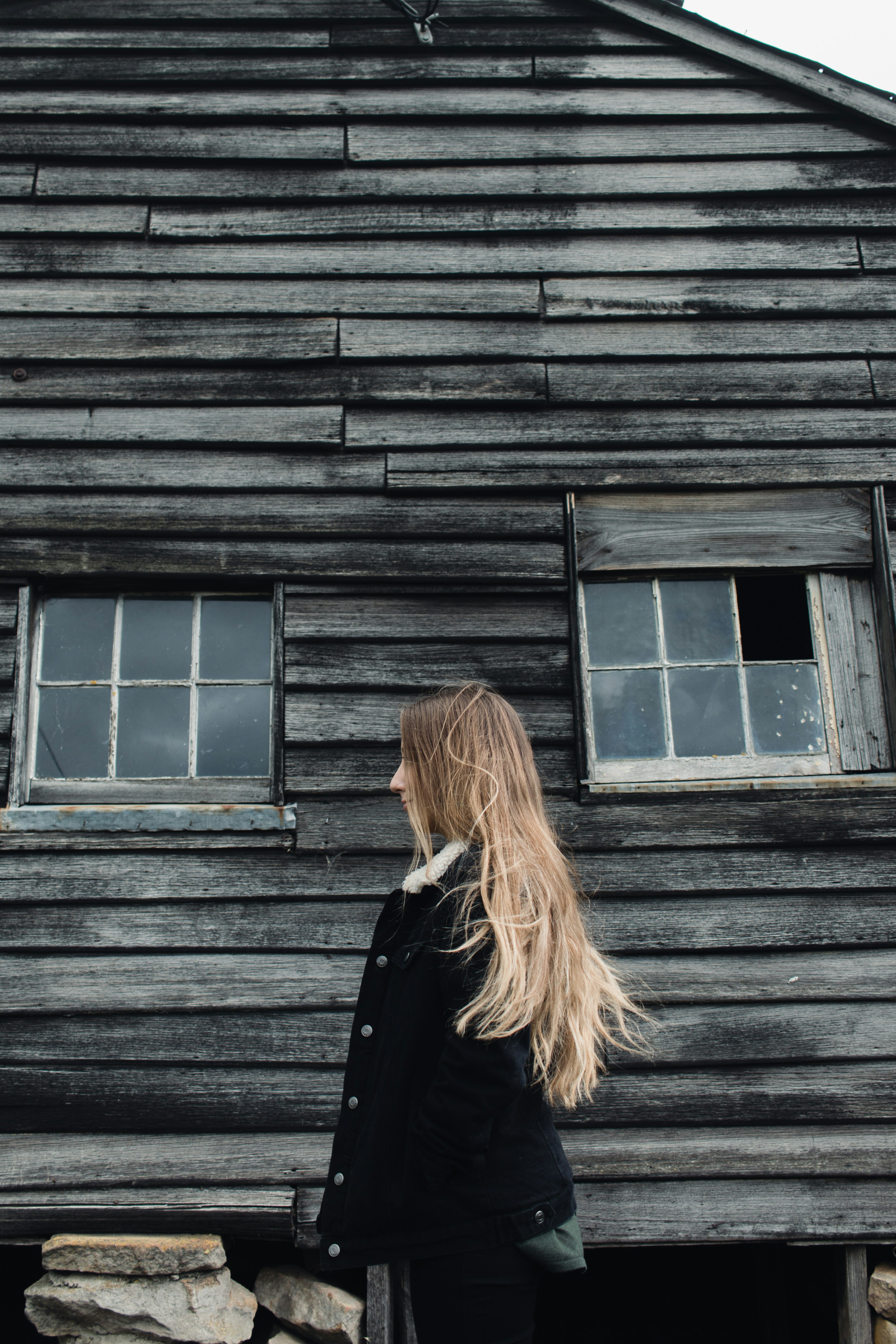 woman standing near cabin